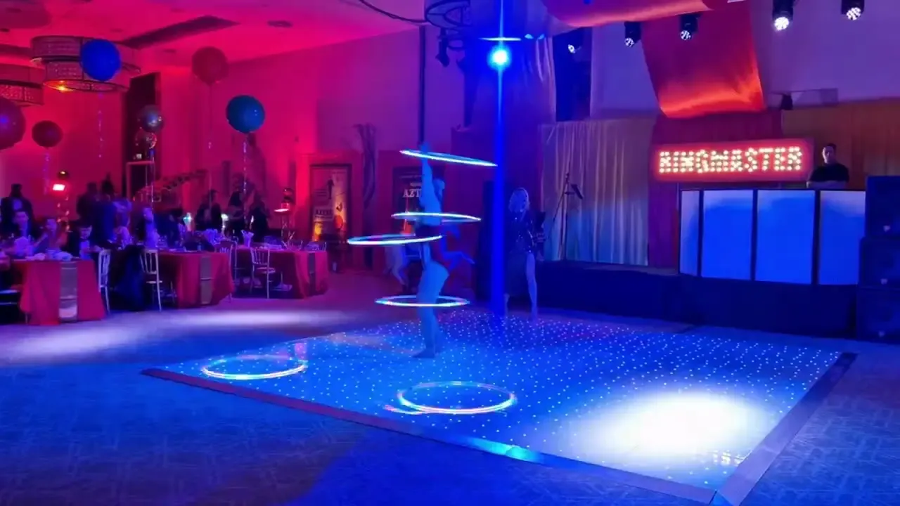 Singer with live circus performers, the UK