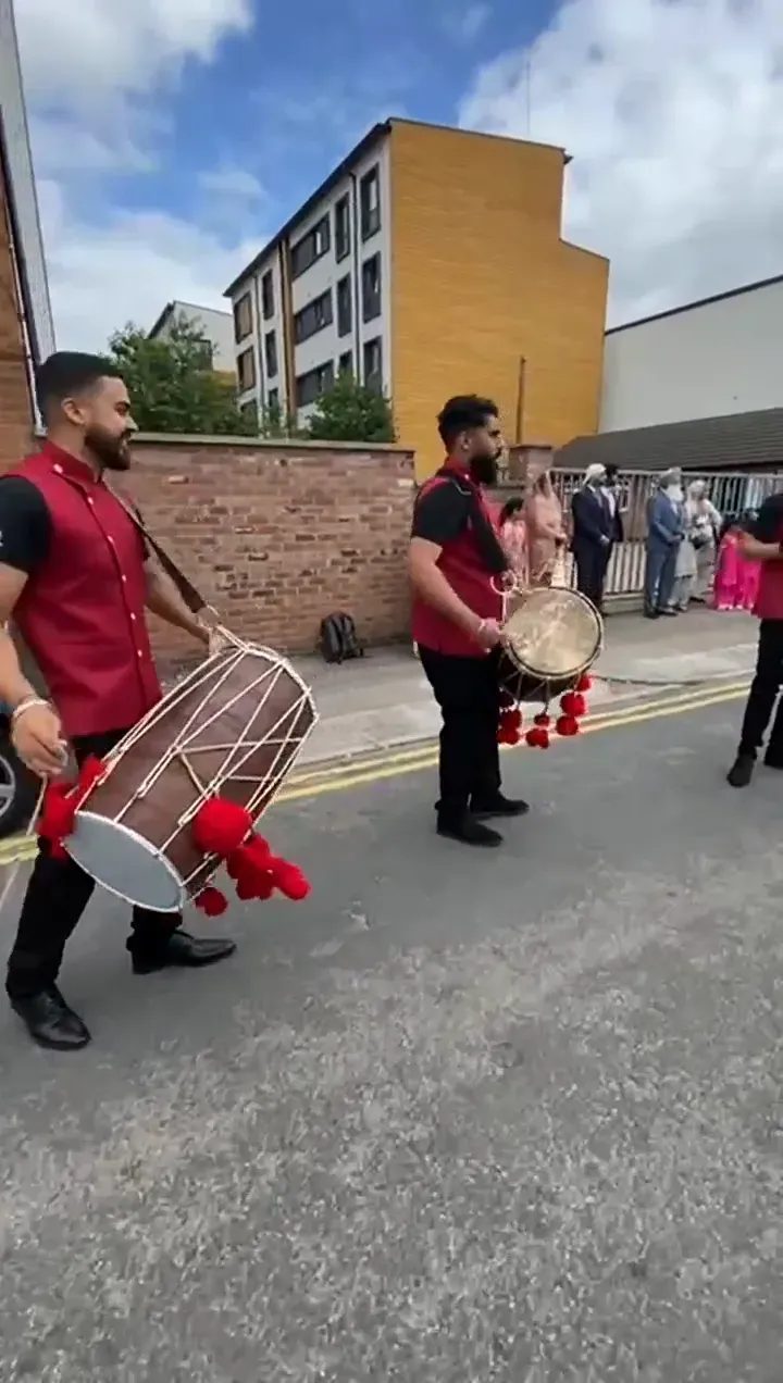 Band baja leading a baraat, the UK