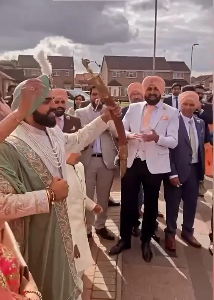 Brass and dhol on the baraat route, the UK