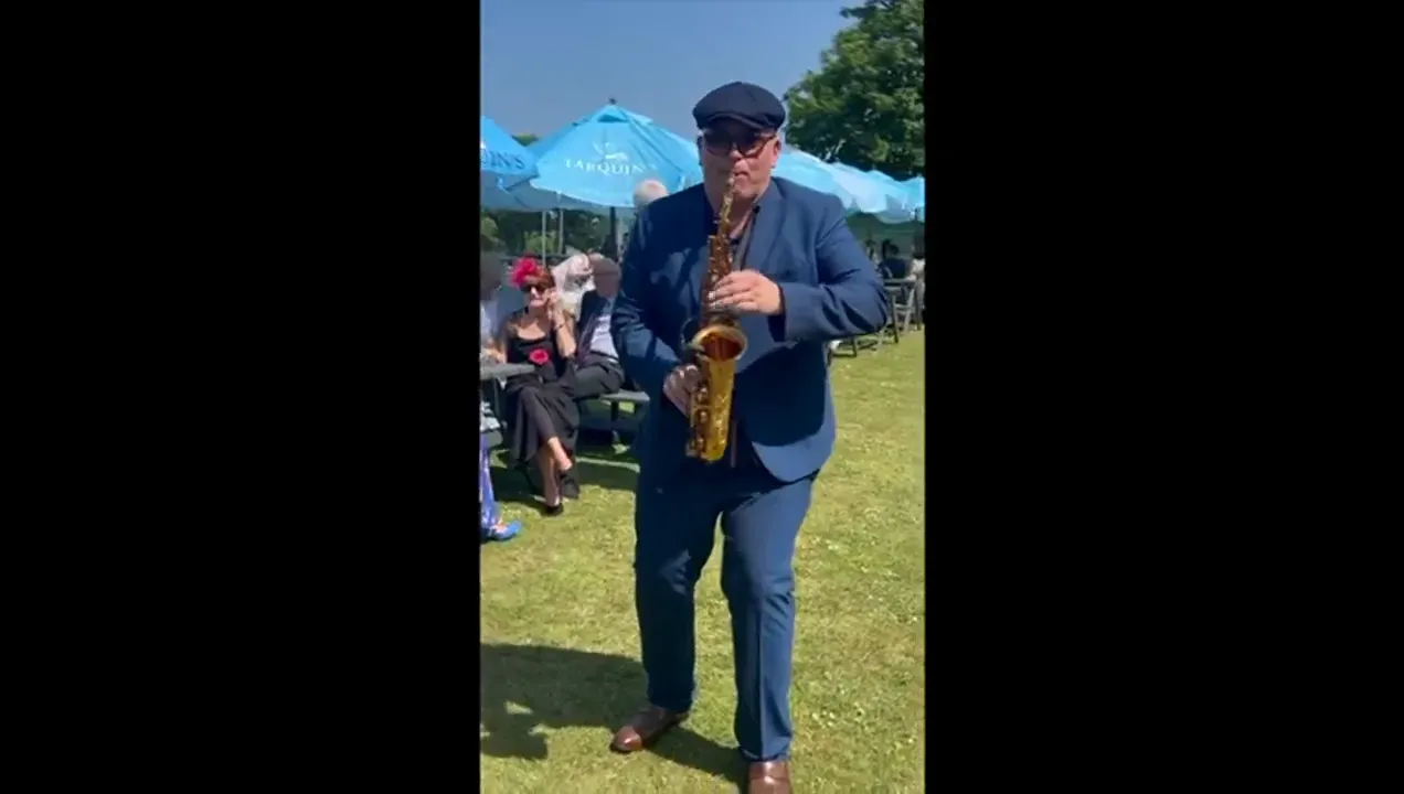 Sax player at a garden party, the UK