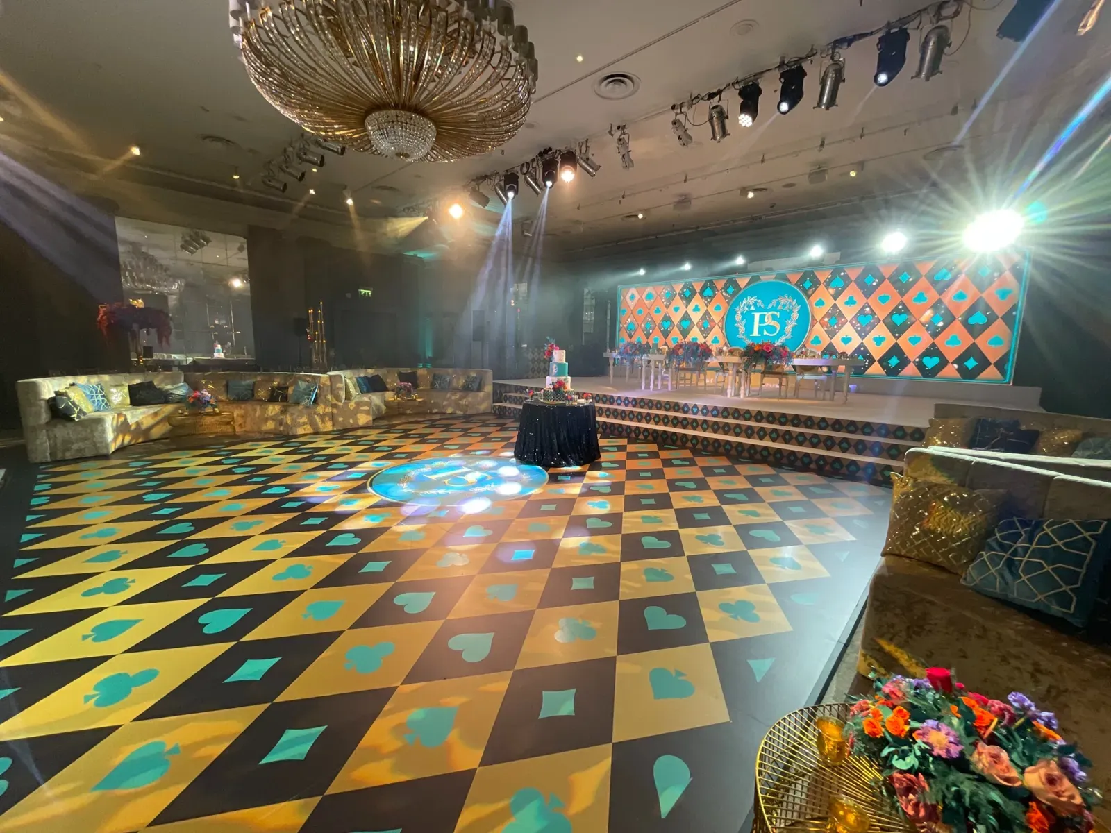 Colourful patterned dance floor and LED screens for a mehndi at Grosvenor House