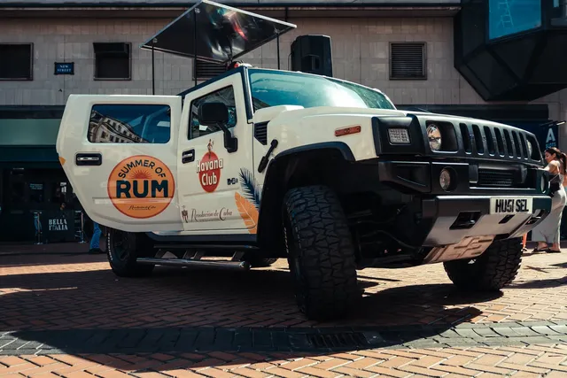 White DJ truck wrapped for a rum brand