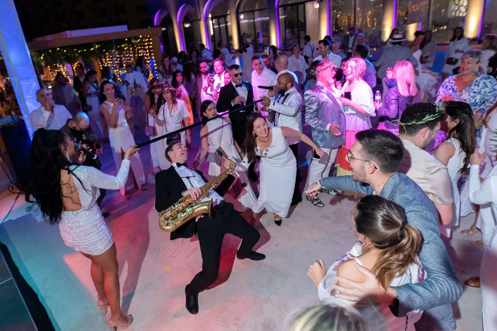 Guests dancing with the band in the middle of the crowd