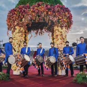 Dhol players performing at a wedding