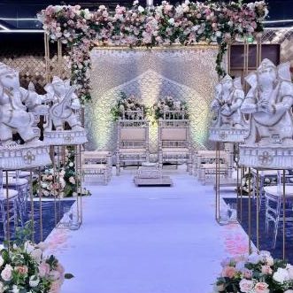 White and floral mandap set up for a ceremony