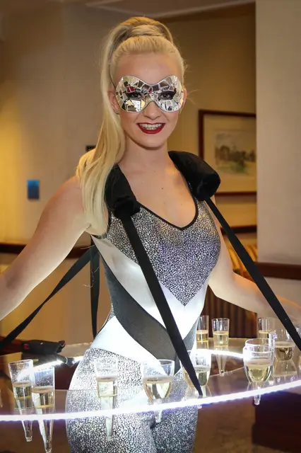 LED strolling table masquerade futuristic silver black catsuit: champagne walkers, venetian masquerade theme