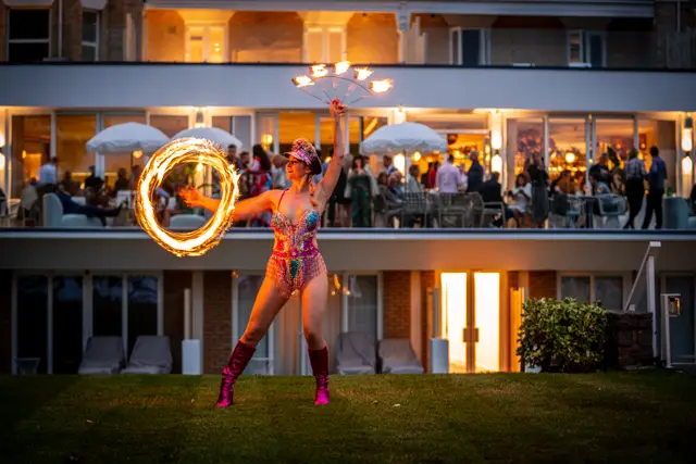 Fire fans spinning: fire performers