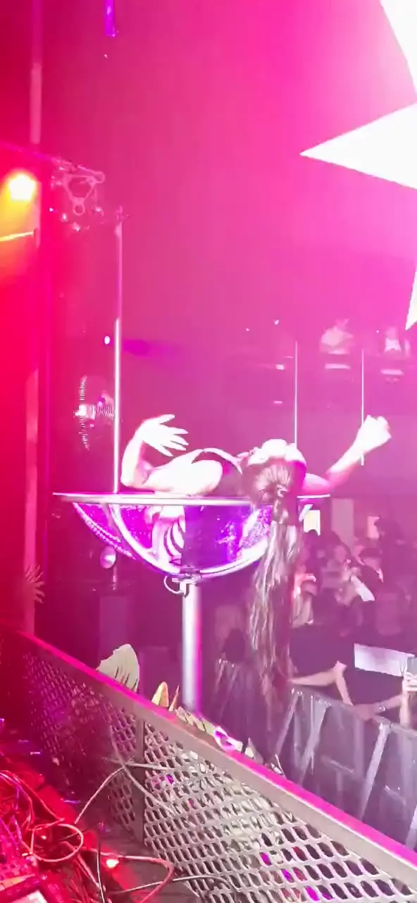 Duo martini in nightlife setting: giant martini glass