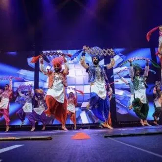 Bhangra dancers performing on stage